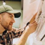 repairman-doing-air-conditioner-service-2-min